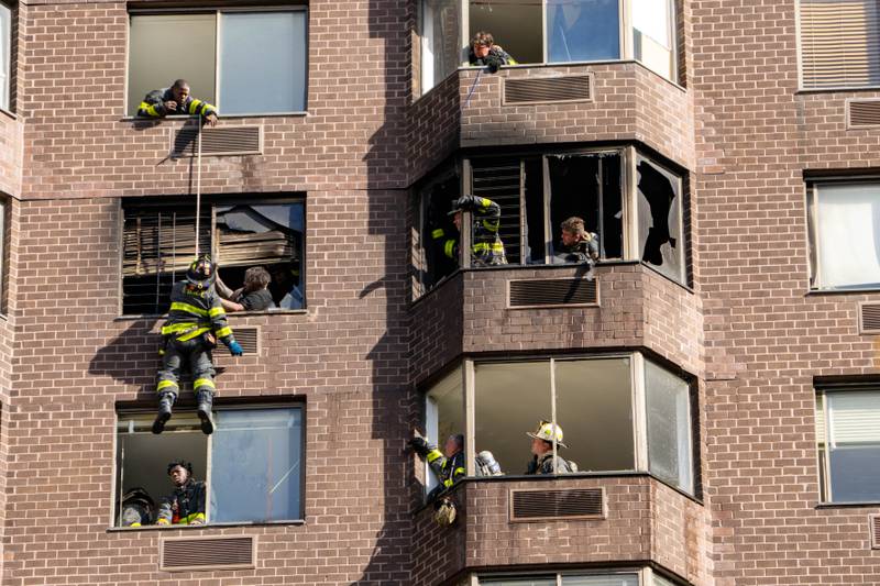 FDNY Rescue Woman Dangling From 20th-Story Window Of Manhattan High-Rise